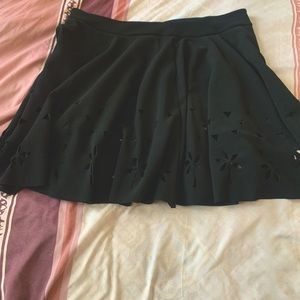 Black mini skirt. Never worn. Approximately 18 inches long